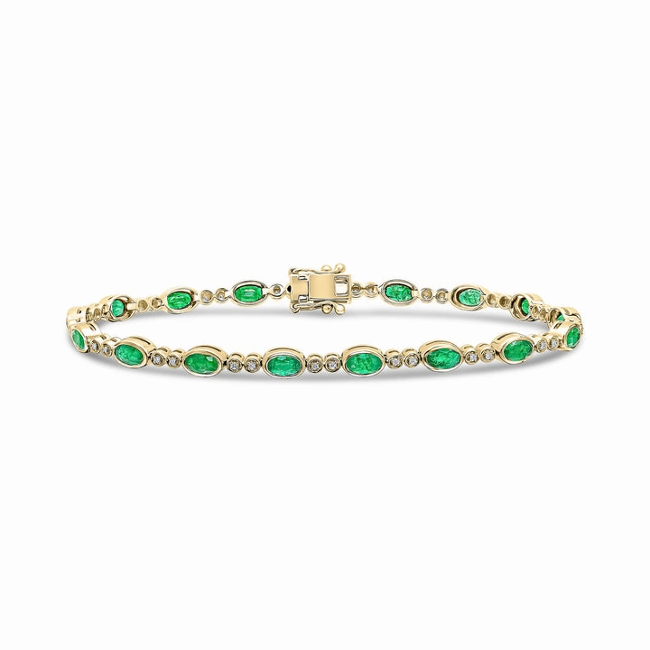 18ct Gold yellow and white gold oval emerald and brilliant cut diamond bracelet