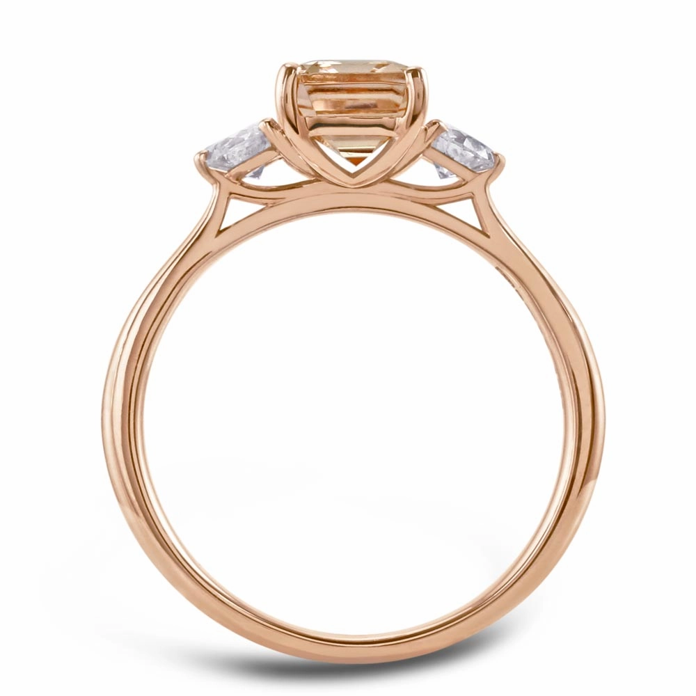 18ct Rose Gold 1.63ct Emerald Cut Morganite And 0.31ct Round Brilliant Cut Diamond Three Stone Ring
