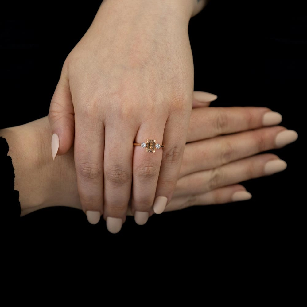 18ct Rose Gold 1.63ct Emerald Cut Morganite And 0.31ct Round Brilliant Cut Diamond Three Stone Ring