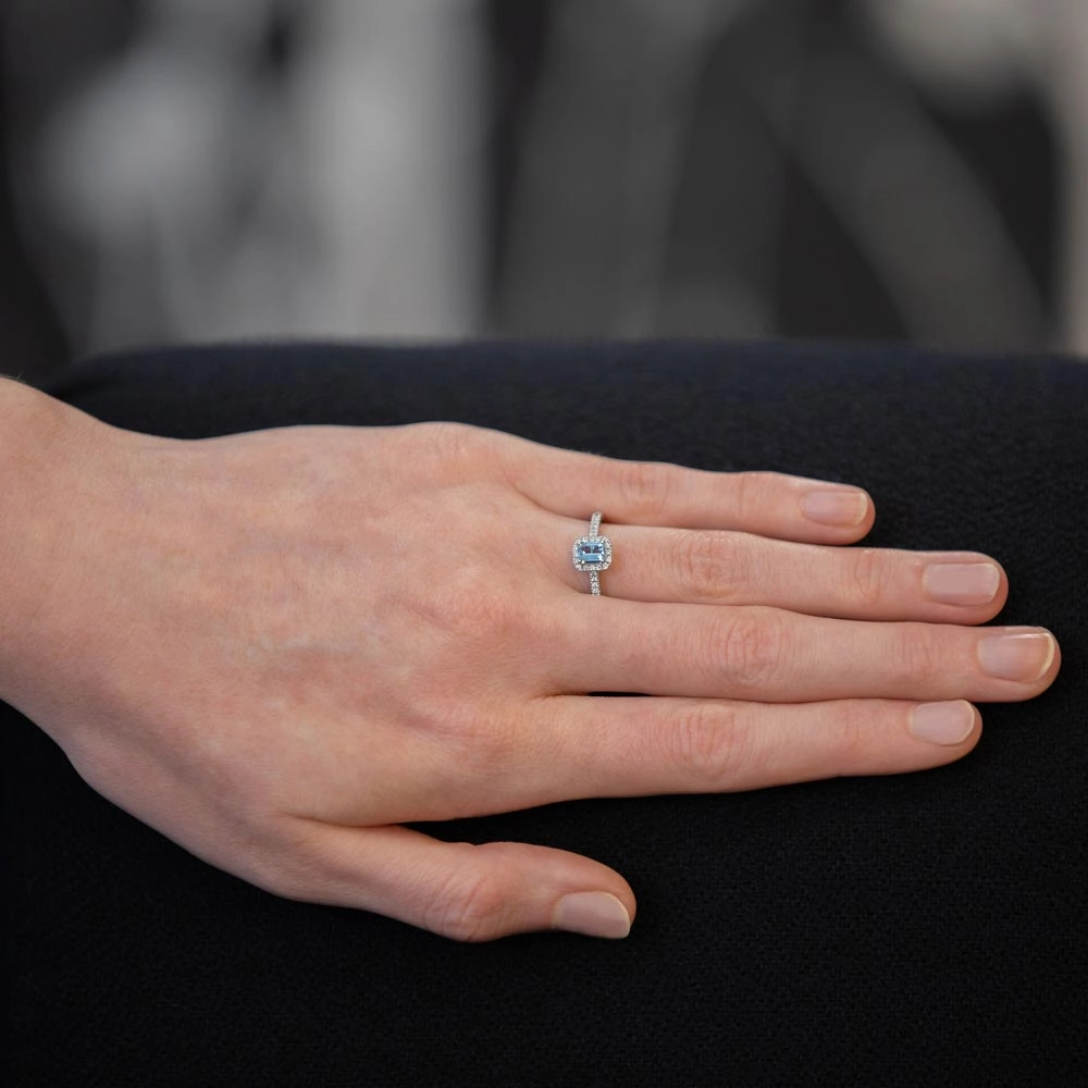 18ct White Gold 0.38ct Emerald Cut Aquamarine And 0.18ct Diamond Halo And Shoulders Ring