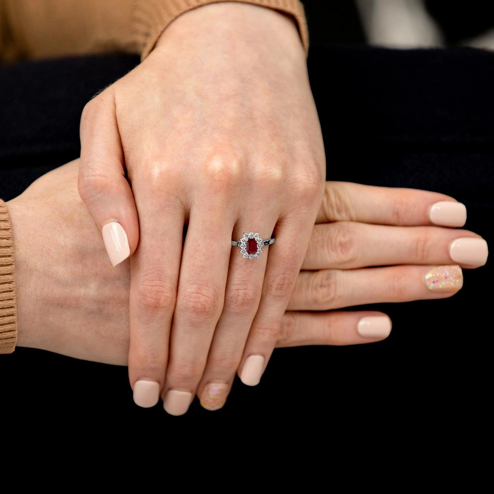 18ct White Gold 0.51ct Emerald Cut Ruby And 0.35ct Round Brilliant Cut Diamond Halo Cluster Ring