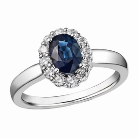 18ct White Gold 1.05ct Oval Cut Blue Sapphire And 0.42ct Round Brilliant Cut Diamond Cluster Ring