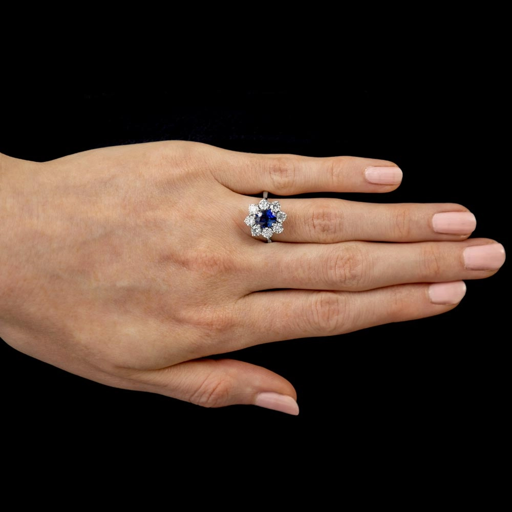 18ct White Gold 1.70ct Oval Cut Blue Sapphire And 1.65ct Round Brilliant Cut Diamond Halo Cluster Ring
