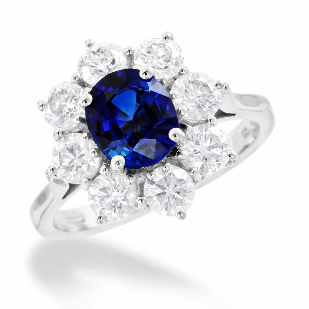18ct White Gold 1.70ct Oval Cut Blue Sapphire And 1.65ct Round Brilliant Cut Diamond Halo Cluster Ring