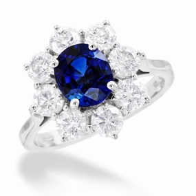 18ct White Gold 1.70ct Oval Cut Blue Sapphire And 1.65ct Round Brilliant Cut Diamond Halo Cluster Ring