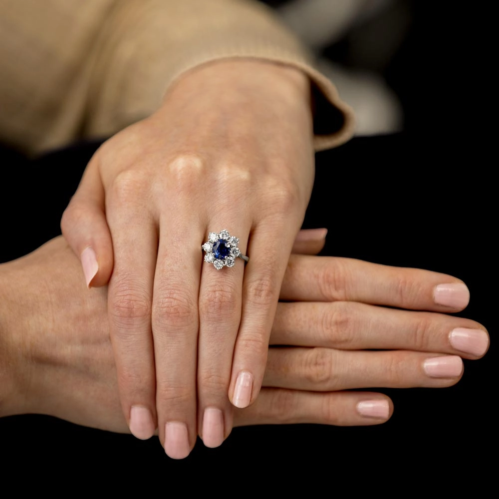 18ct White Gold 1.70ct Oval Cut Blue Sapphire And 1.65ct Round Brilliant Cut Diamond Halo Cluster Ring