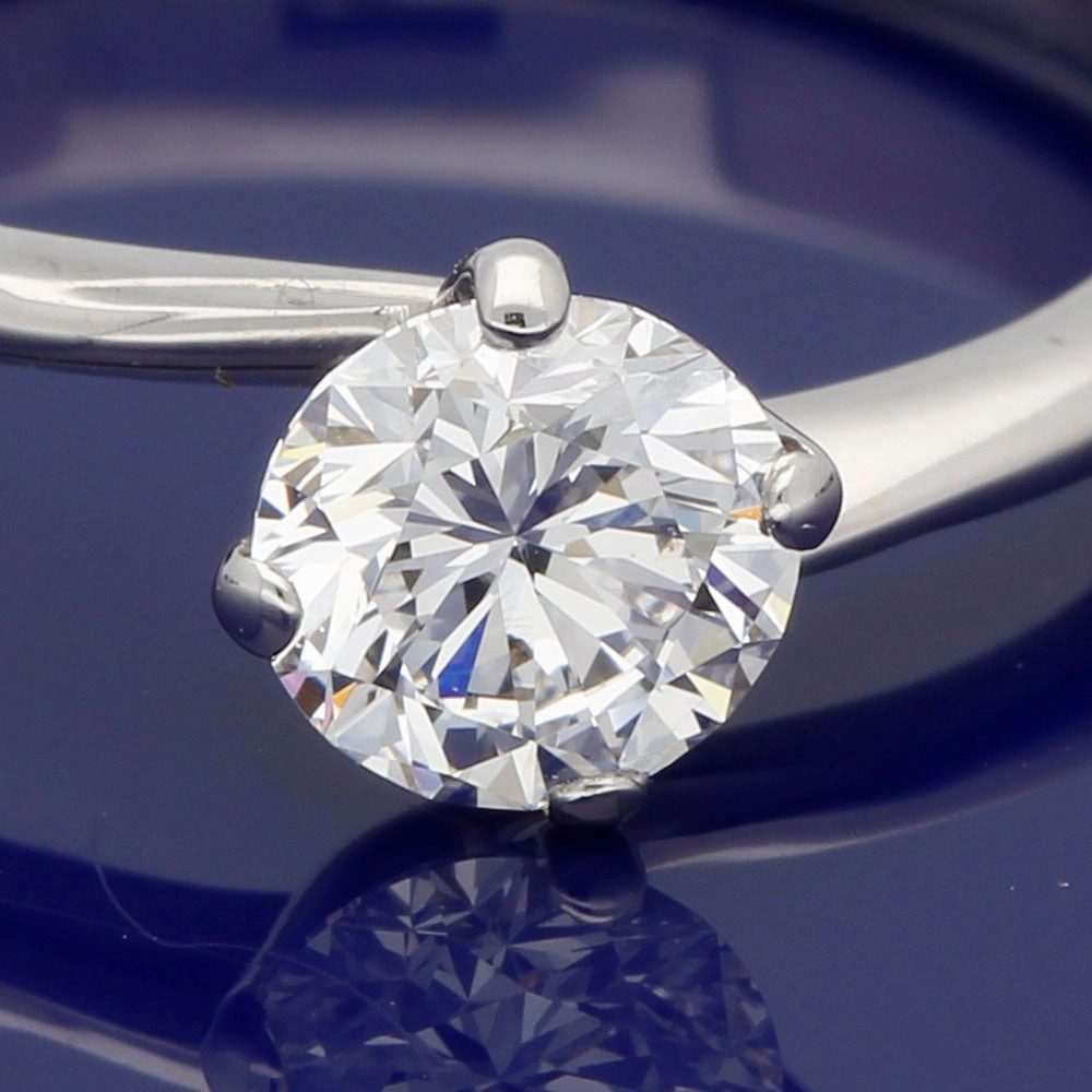 18ct White Gold Certificated 0.59ct Diamond Solitaire Twist Ring D/VVS1