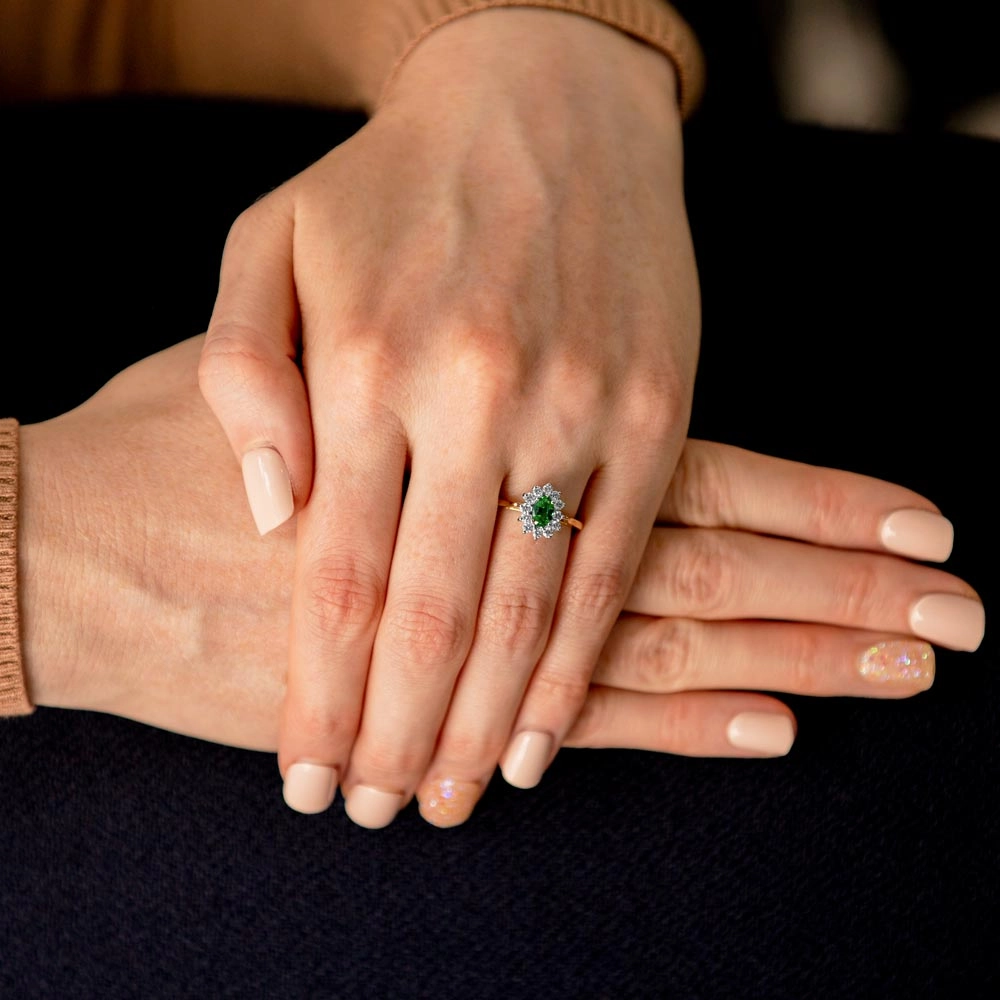 18ct Yellow And White Gold 0.35ct Oval Cut Emerald And 0.35ct Round Brilliant Cut Diamond Halo Cluster Ring