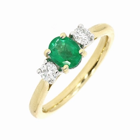 18ct Yellow And White Gold 0.65ct Oval Cut Emerald And 0.27ct Round Brilliant Cut Diamond Three Stone Engagement Ring