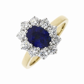 18ct yellow gold oval sapphire and round brilliant cut diamond claw set ring