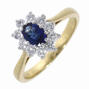 18ct yellow gold oval sapphire and round brilliant cut diamond claw set ring