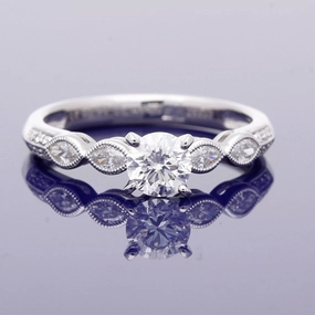 Platinum 0.56ct Solitaire with Diamond Set Shoulders Ring