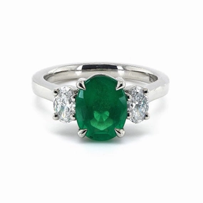 Platinum 1.34ct Oval Cut Emerald And 0.46ct Oval Cut Diamond Three Stone Ring