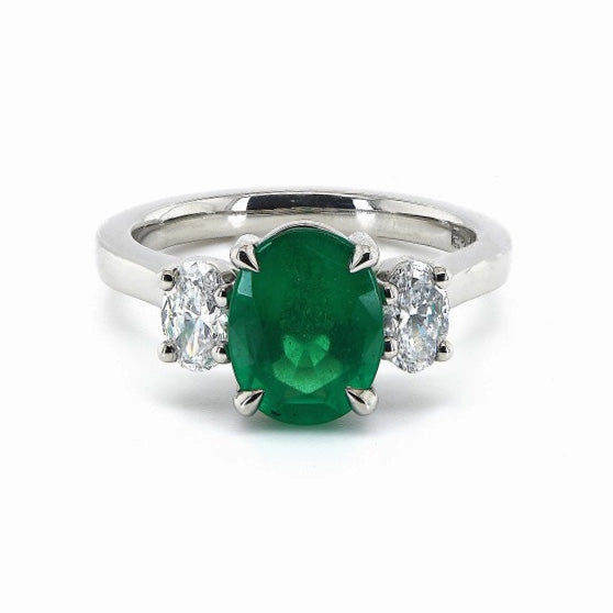 Platinum 1.34ct Oval Cut Emerald And 0.46ct Oval Cut Diamond Three Stone Ring
