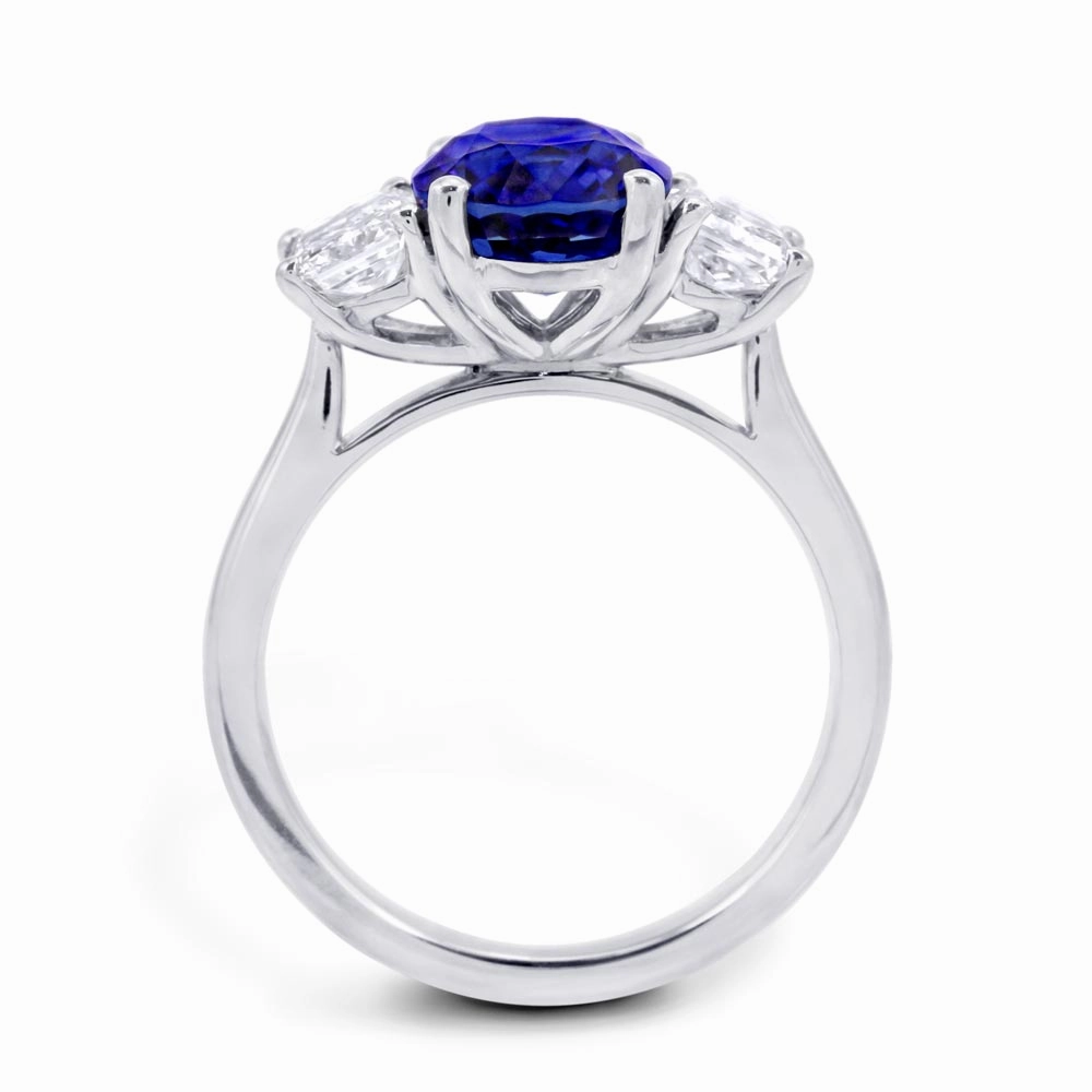Platinum 3.16ct Oval Cut Sapphire And 1.06ct Radiant Cut Diamond Three Stone Ring