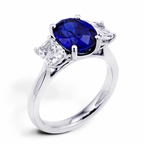 Platinum 3.16ct Oval Cut Sapphire And 1.06ct Radiant Cut Diamond Three Stone Ring