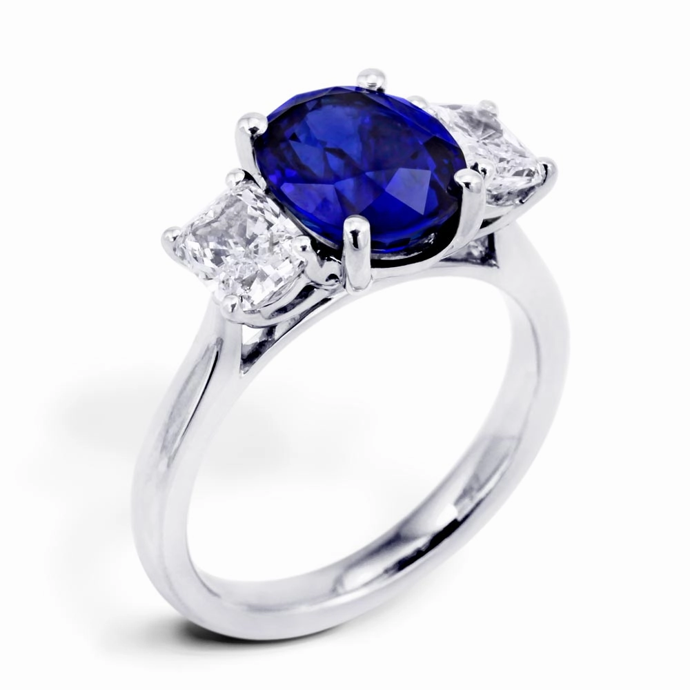 Platinum 3.16ct Oval Cut Sapphire And 1.06ct Radiant Cut Diamond Three Stone Ring