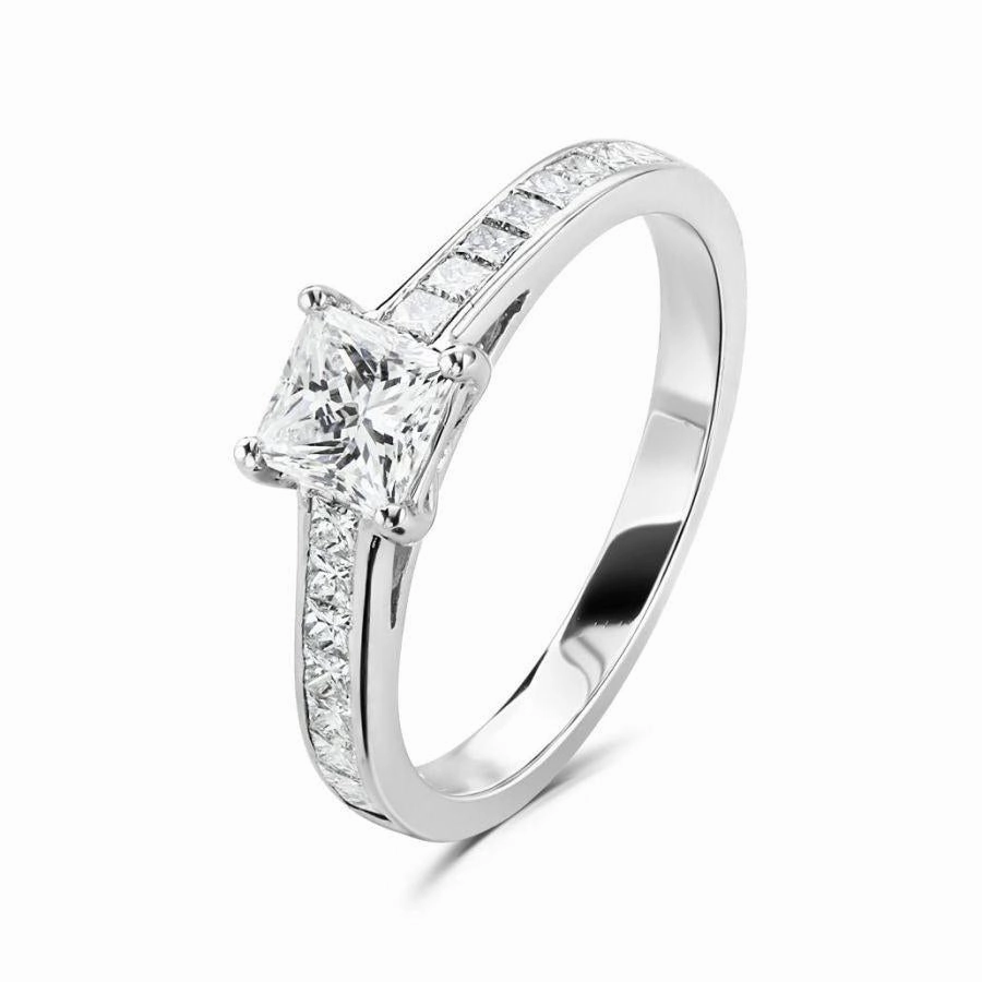 Platinum 4 claw set princess cut Diamond solitaire ring with princess cut Diamond shoulders