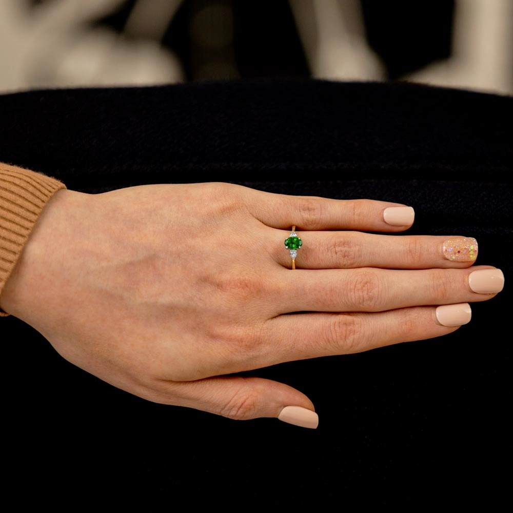 Platinum And 18ct Yellow Gold 0.78ct Oval Cut Emerald And 0.27ct Pear Cut Diamond Three Stone Engagement Ring