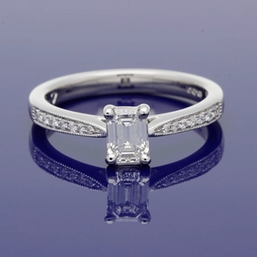 Platinum Certificated 0.53ct Emerald Cut Solitaire Ring with Diamond Shoulders