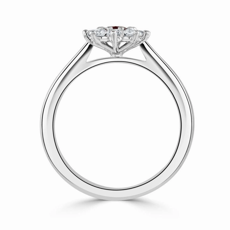 Platinum oval ruby and diamond cluster claw set ring