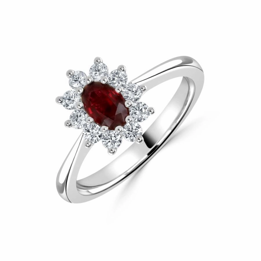 Platinum oval ruby and diamond cluster claw set ring