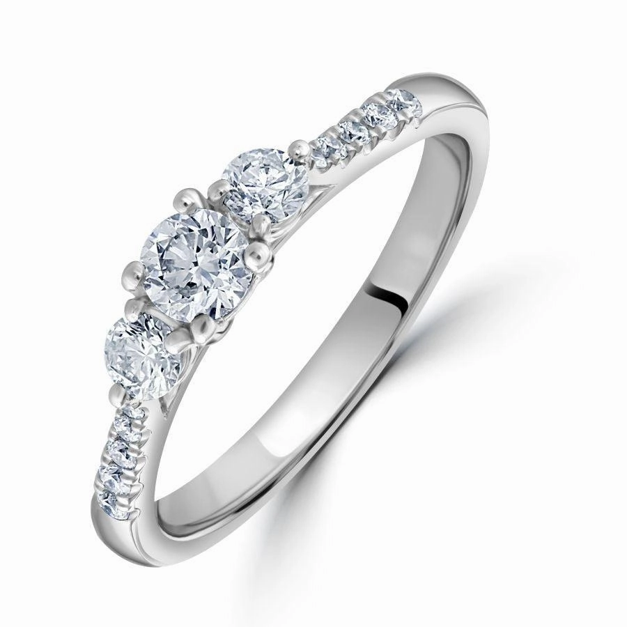 Platinum Round Brilliant Cut Diamond Trilogy Ring with Diamond Shoulders