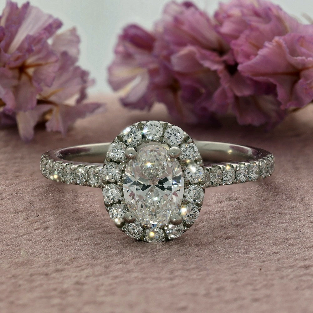 Pre-loved Platinum Certificated 0.60ct Oval Cut Diamond Shoulders Halo Ring