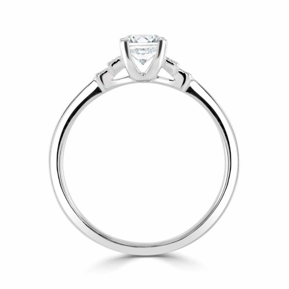 The Cornflower Platinum Round Brilliant Cut Diamond Solitaire Engagement Ring With Diamond Set Shoulders
