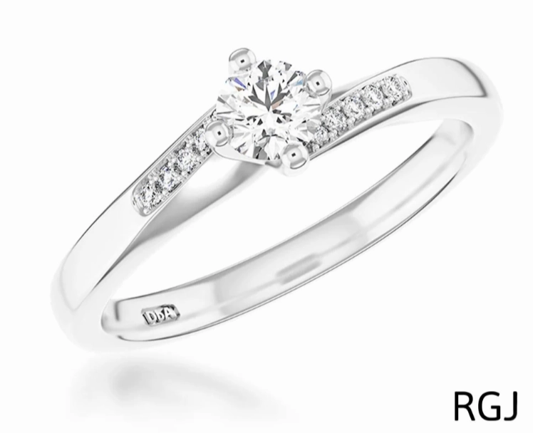 The Dursey Platinum 0.22ct Round Brilliant Cut Diamond Solitaire Engagement Ring With 0.10ct Diamond Set Shoulders