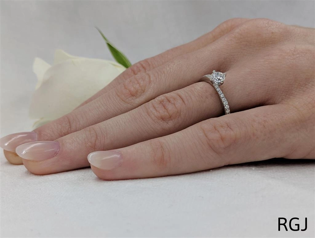 The Dursey Platinum 0.40ct Round Brilliant Cut Diamond Solitaire Engagement Ring With 0.21ct Diamond Set Shoulders