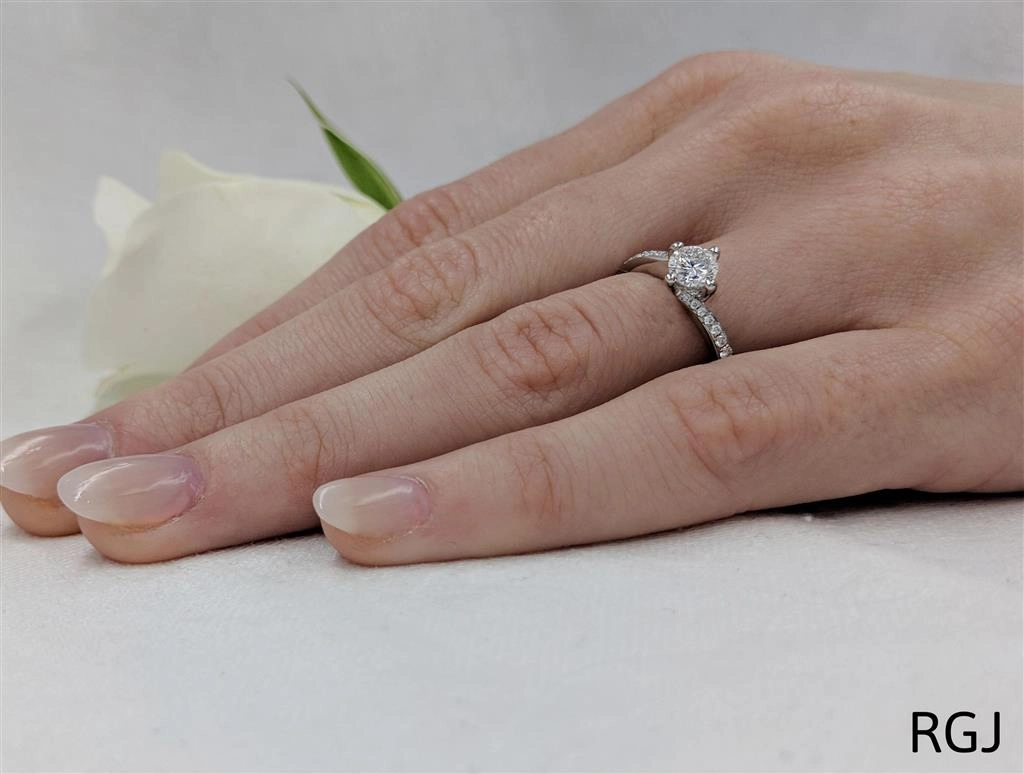 The Dursey Platinum 0.50ct Round Brilliant Cut Diamond Solitaire Engagement Ring With 0.21ct Diamond Set Shoulders