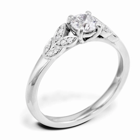 The Fleur Platinum Round Brilliant Cut Diamond Solitaire Engagement Ring With Diamond Leaf Detailing