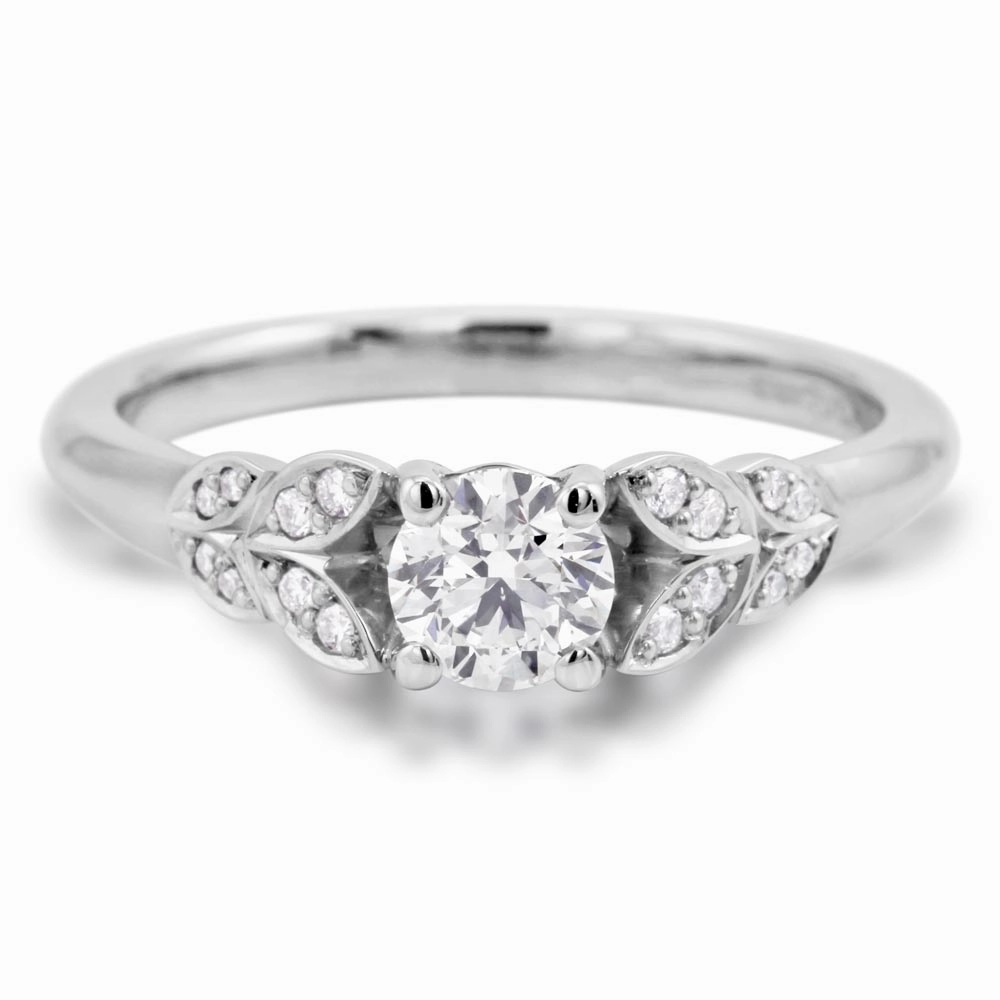 The Fleur Platinum Round Brilliant Cut Diamond Solitaire Engagement Ring With Diamond Leaf Detailing