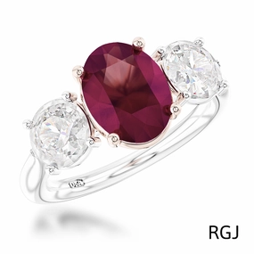 The Florentina Iconic Platinum And 18ct Rose Gold 2.04ct Oval Cut Ruby And 1.01ct Round Brilliant Cut Diamond Three Stone Ring With 0.08ct Diamond Detailing