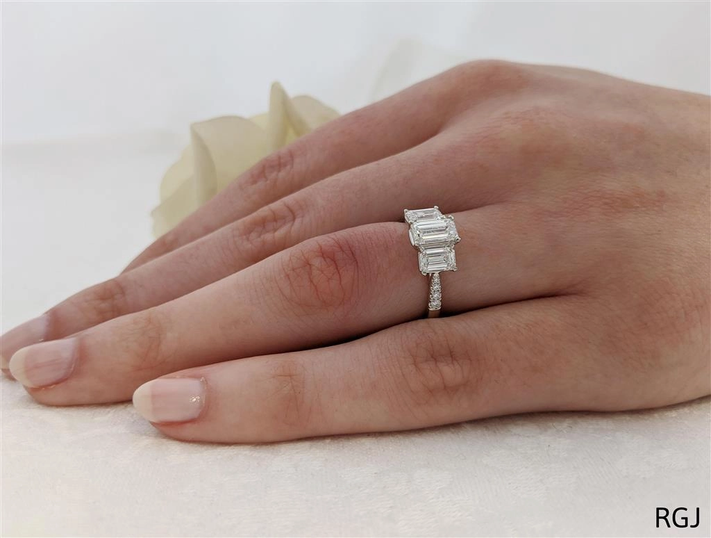 The Florentina Skye Platinum 1.80ct Emerald Cut Diamond Three Stone Engagement Ring With Diamond Set Shoulders