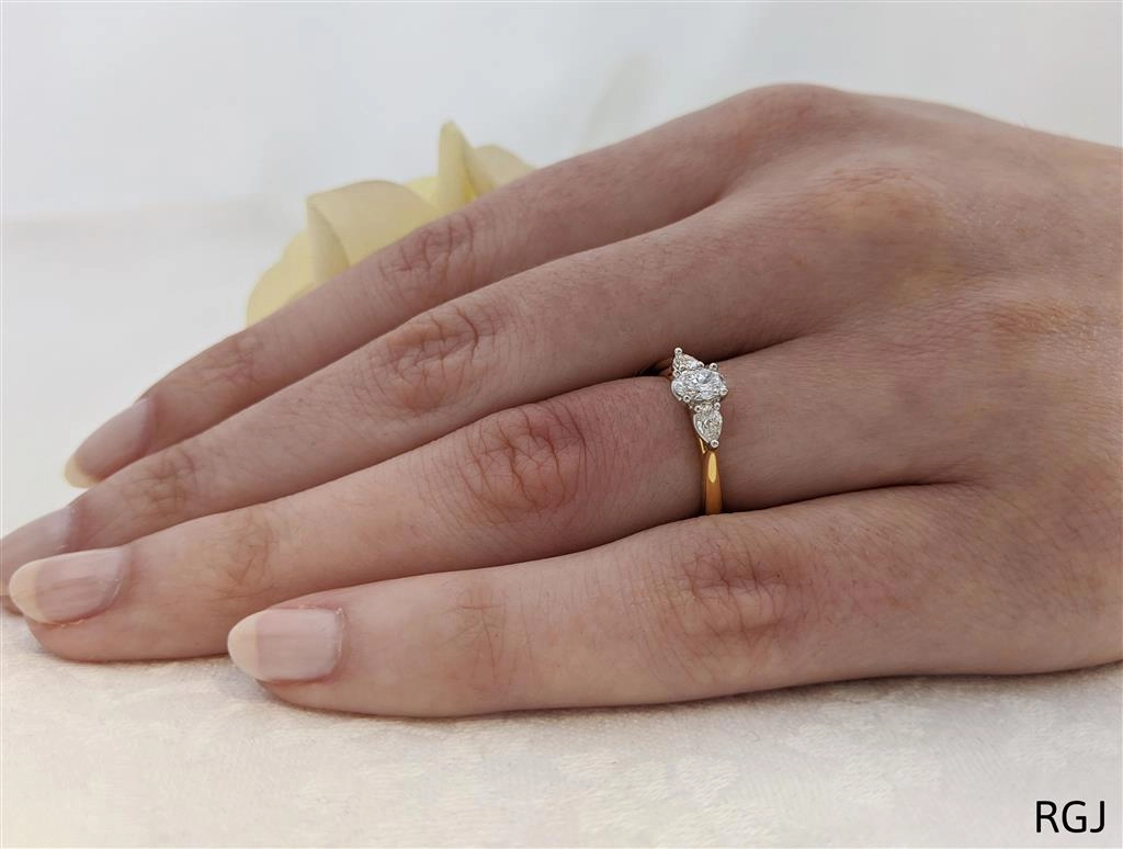 The Florentine 18ct Yellow Gold And Platinum 0.30ct Oval And 0.20ct Pear Cut Diamond Three Stone Engagement Ring