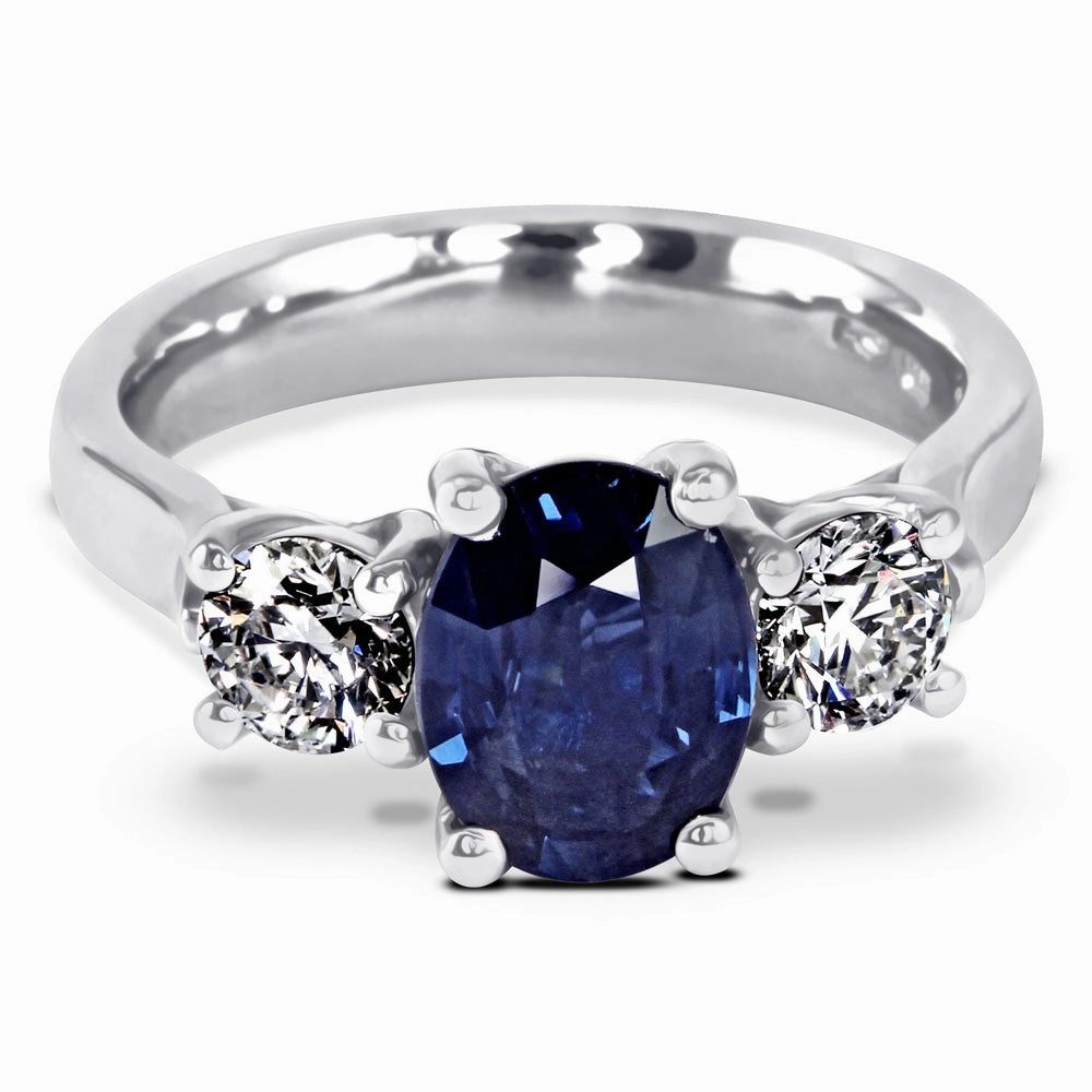 The Larkspur Platinum 2.14ct Oval Sapphire and 0.80ct Diamond Three Stone Engagement Ring