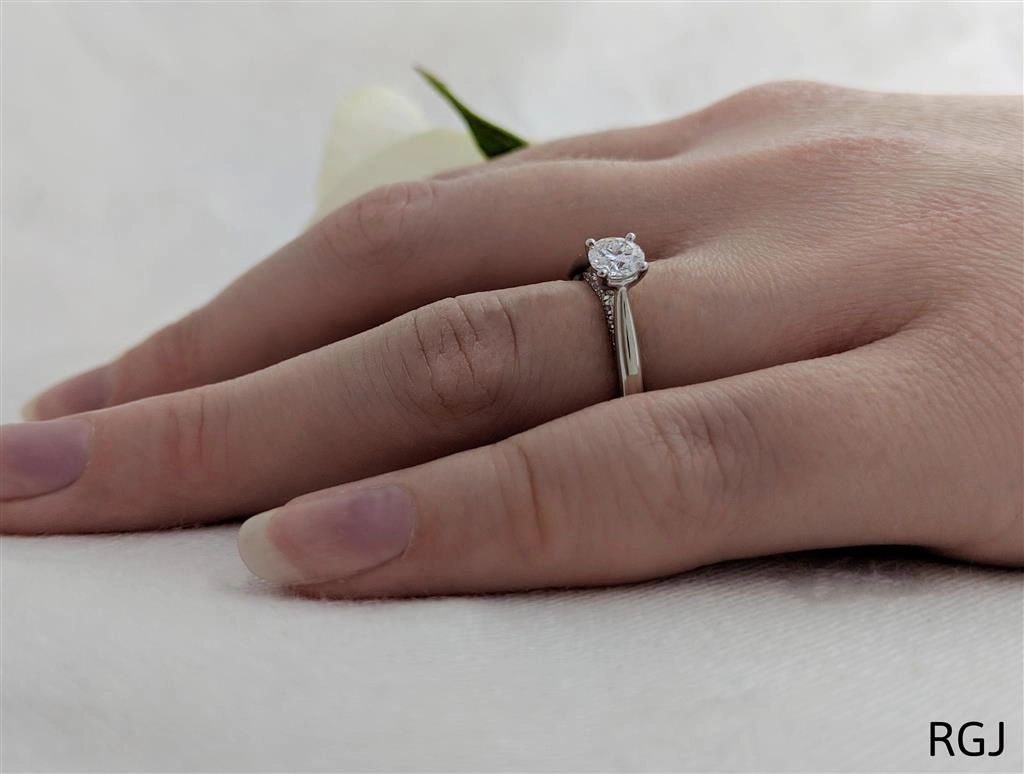 The Oxford Platinum 0.40ct Round Brilliant Cut Diamond Solitaire Engagement Ring With 0.07ct Diamond Detailing