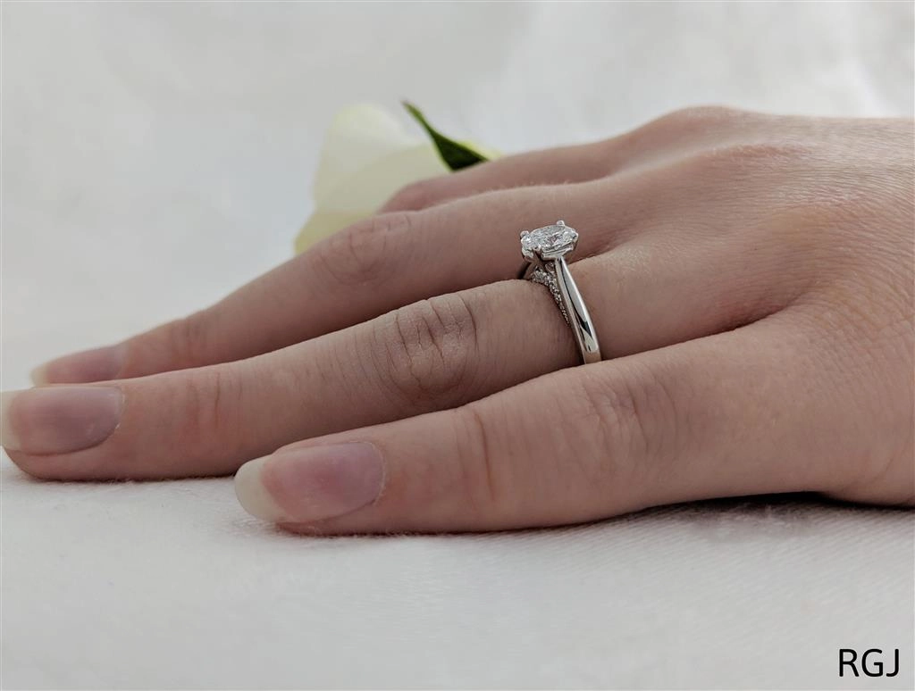 The Oxford Platinum 0.50ct Oval Cut Diamond Solitaire Engagement Ring With 0.07ct Diamond Detailing