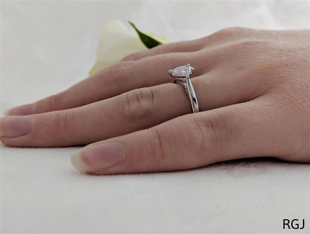 The Oxford Platinum 0.50ct Pear Cut Diamond Solitaire Engagement Ring With 0.07ct Diamond Detailing
