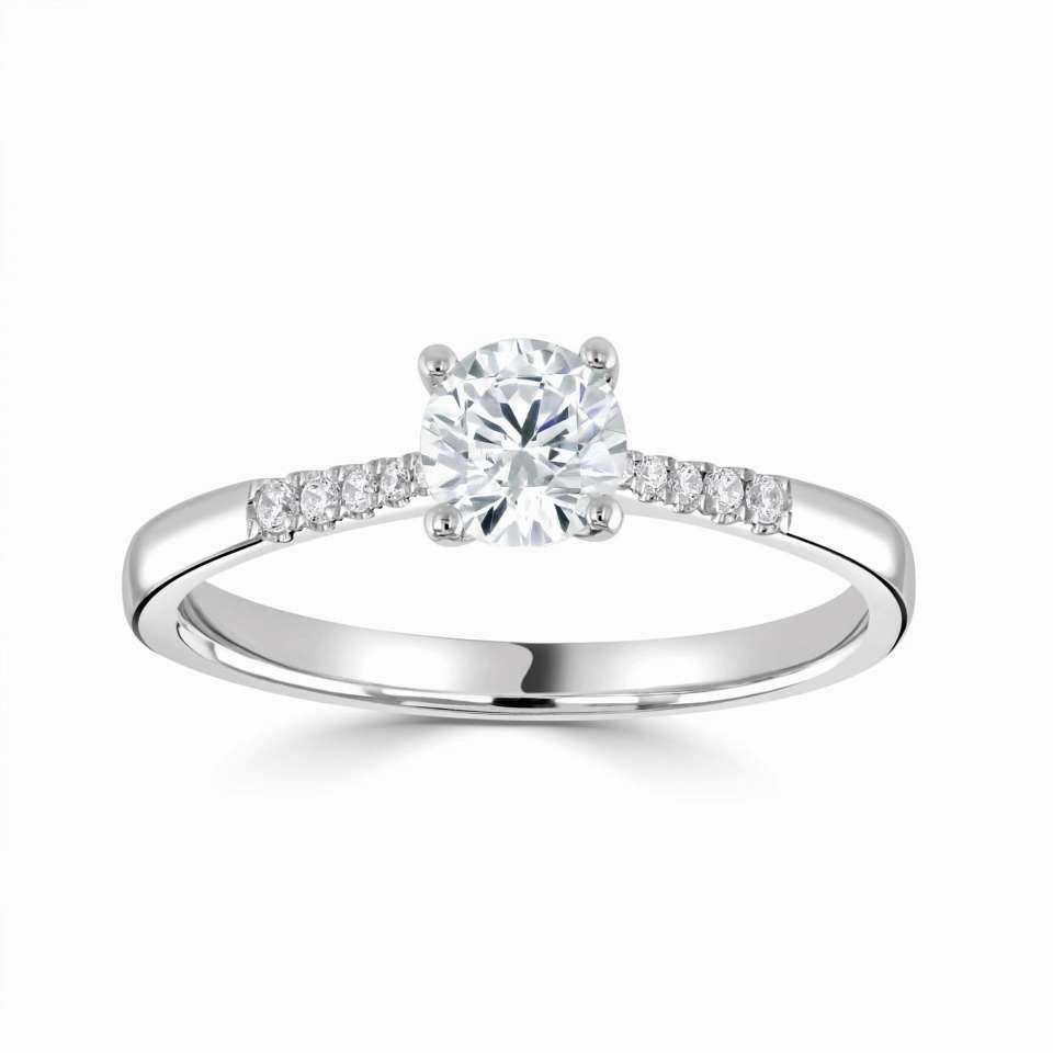 The Primula Platinum Round Brilliant Cut Diamond Solitaire Engagement Ring With Diamond Set Shoulders