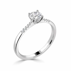 The Primula Platinum Round Brilliant Cut Diamond Solitaire Engagement Ring With Diamond Set Shoulders
