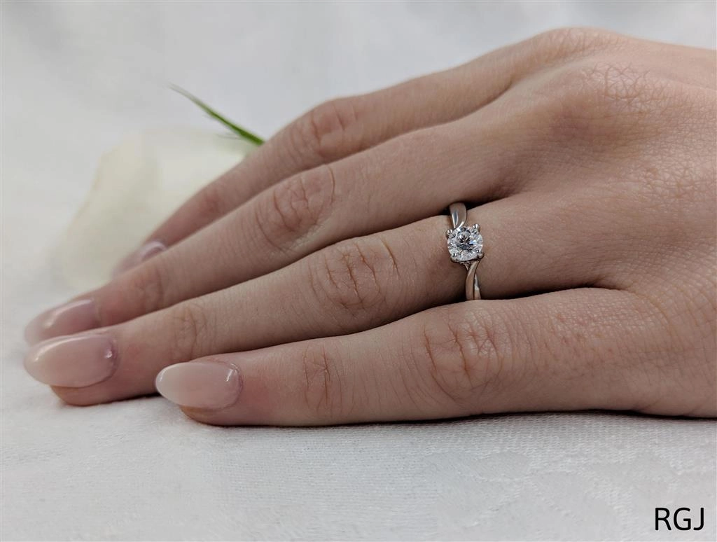 The Rona Four Claw Platinum 0.40ct Round Brilliant Cut Diamond Solitaire Engagement Ring With 0.04ct Diamond Detailing