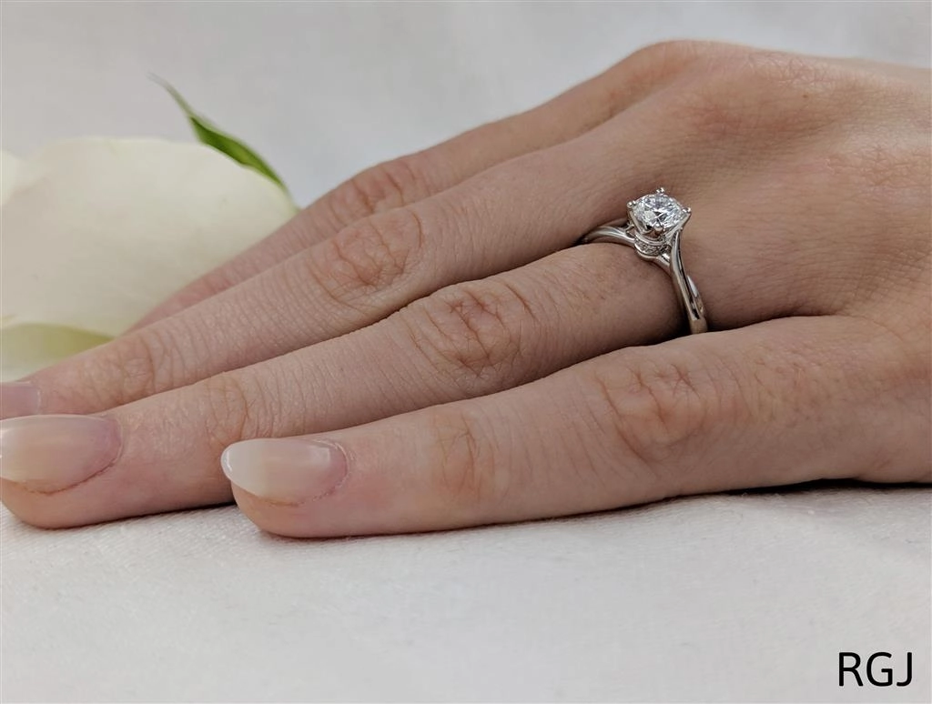 The Rona Four Claw Platinum 0.50ct Round Brilliant Cut Diamond Solitaire Engagement Ring With 0.04ct Diamond Detailing