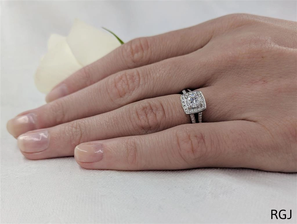 The Saturn Platinum 0.41ct Round Brilliant Cut Diamond Engagement Ring With 0.20ct Diamond Halo And Diamond Set Split Shoulders