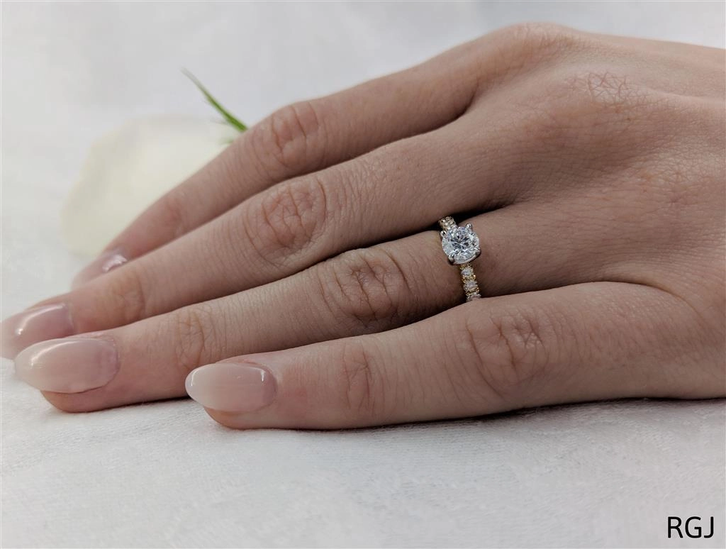 The Skye Classic 18ct Yellow Gold And Platinum 0.60ct Round Brilliant Cut Diamond Solitaire Engagement Ring With 0.26ct Diamond Set Shoulders
