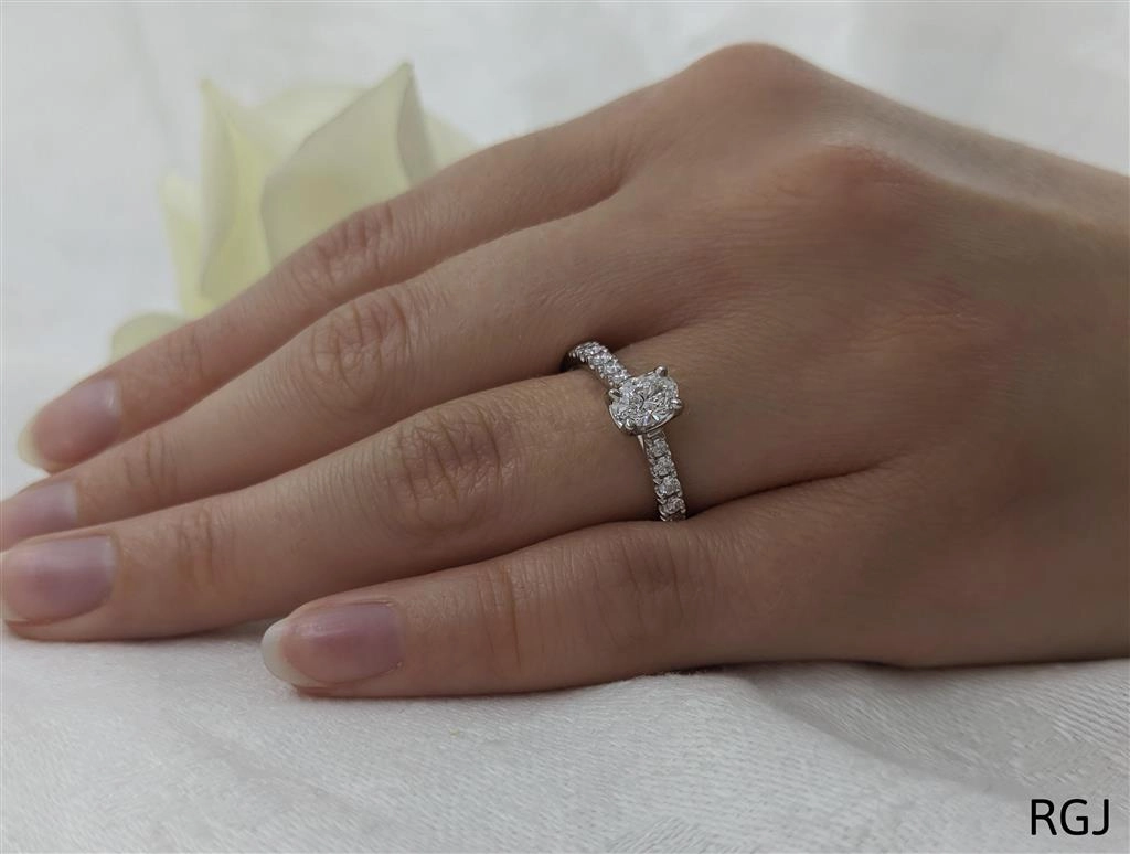 The Skye Classic Platinum 0.50ct Oval Cut Diamond Solitaire Engagement Ring With 0.20ct Diamond Set Shoulders