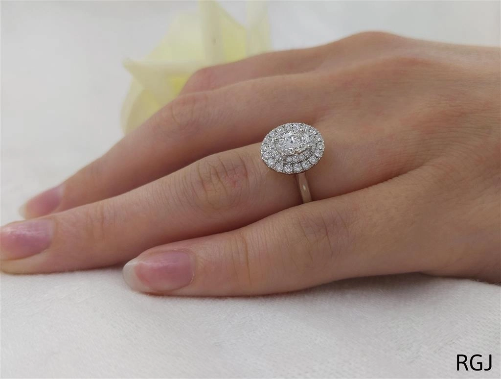 The Skye Duo Platinum 0.48ct Oval Cut Diamond Engagement Ring With 0.30ct Double Diamond Halo