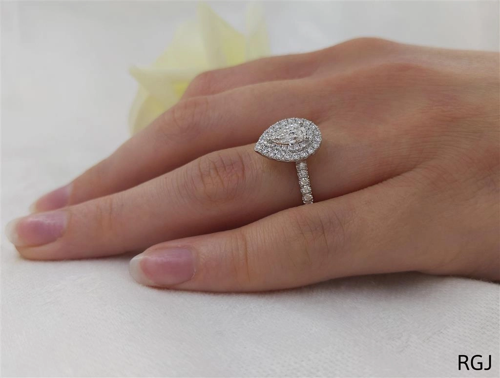 The Skye Duo Platinum 0.52ct Pear Cut Diamond Engagement Ring With 0.52ct Double Diamond Halo And Diamond Set Shoulders